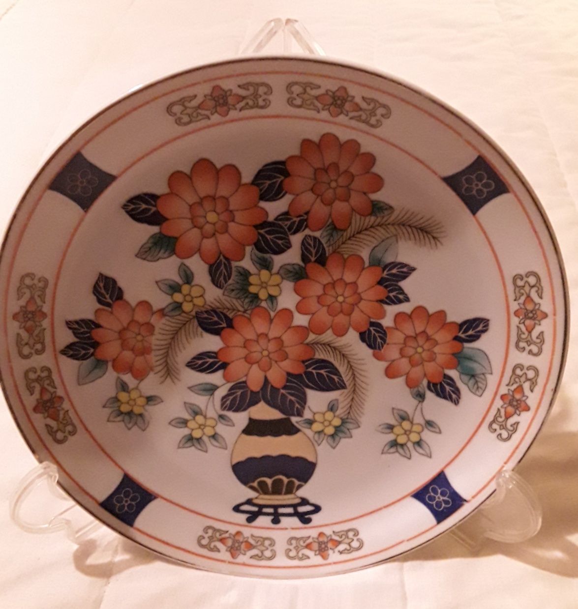 Prato decorativo com flores laranjas com 22 cm