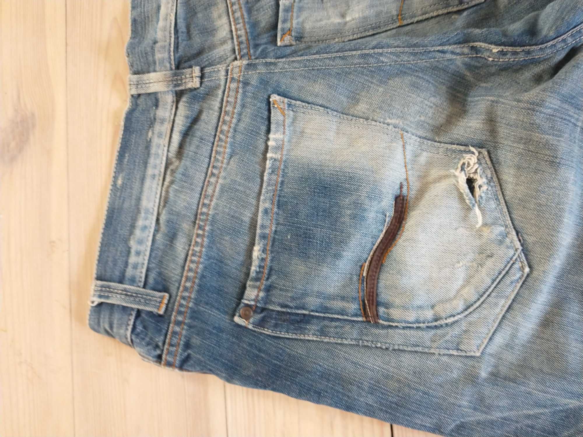 Jeansy męskie używane z przecierkami i dziurami Denim
