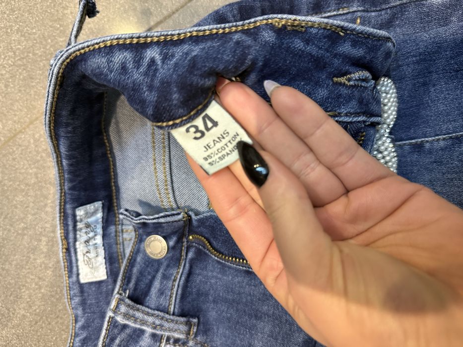 Spodnie jeansowe xs wysoki stan niebieskie kokardki cekiny 34