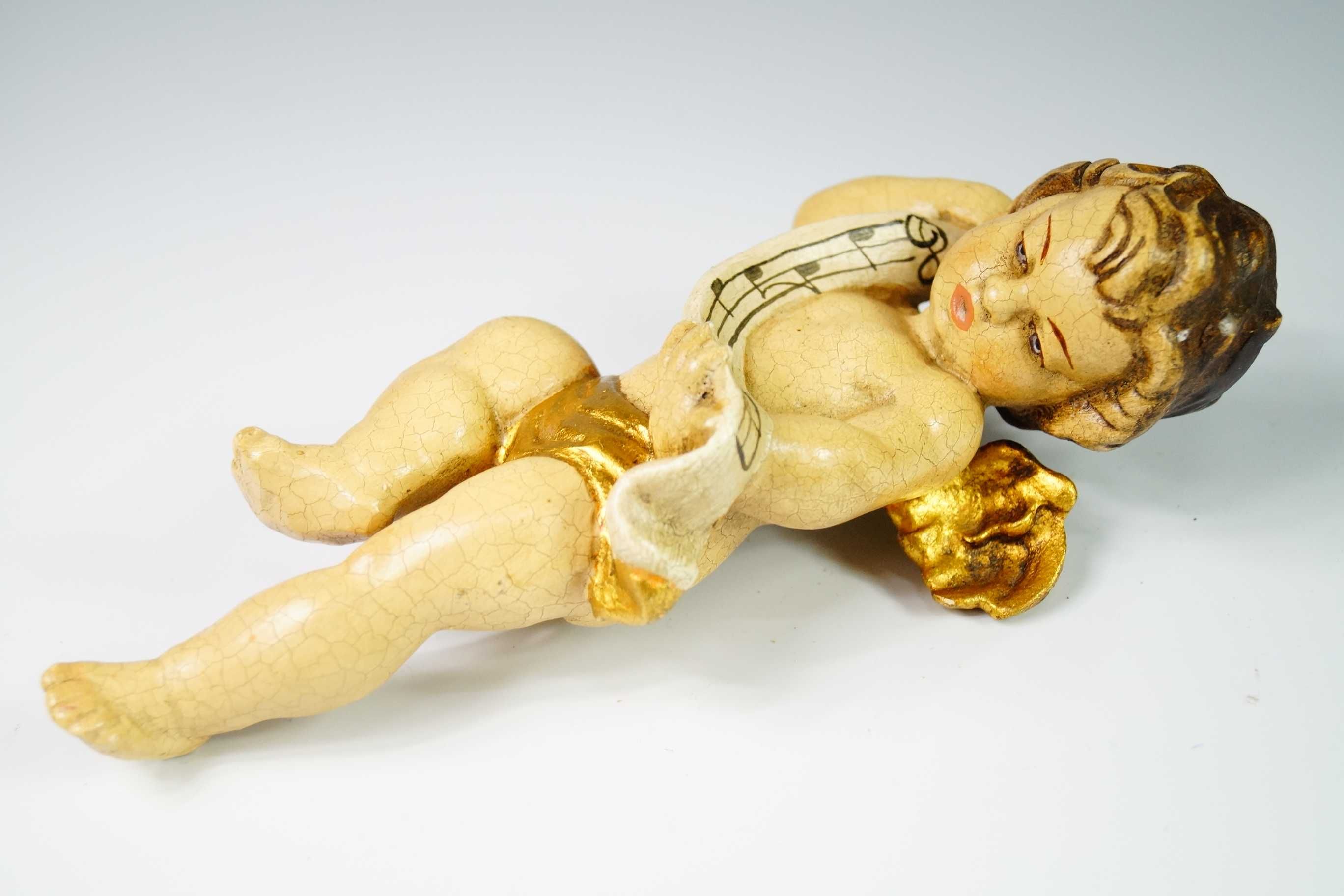 Rzeźba w polichromii putto z nutami drewno figura