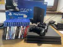 PS4 Pro 1T + sluchawki + 3 pady + stojak + gry + cukierek
