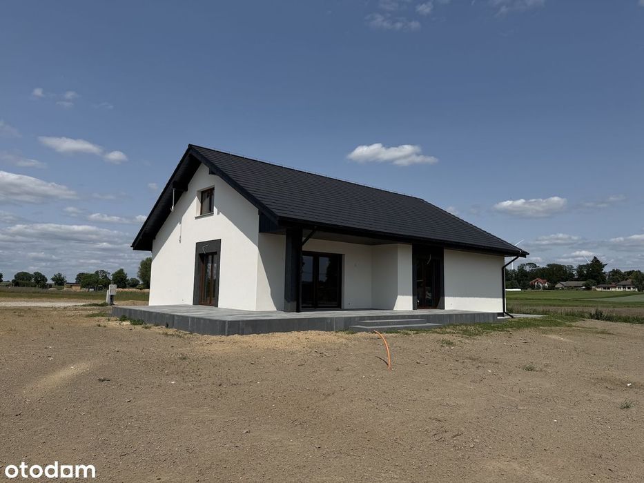Nowy dom z przepięknym salonem i dużą działką. Zadzwoń !