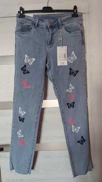 Sprzedam spodnie damskie jeansowe z motylkami NOWE!