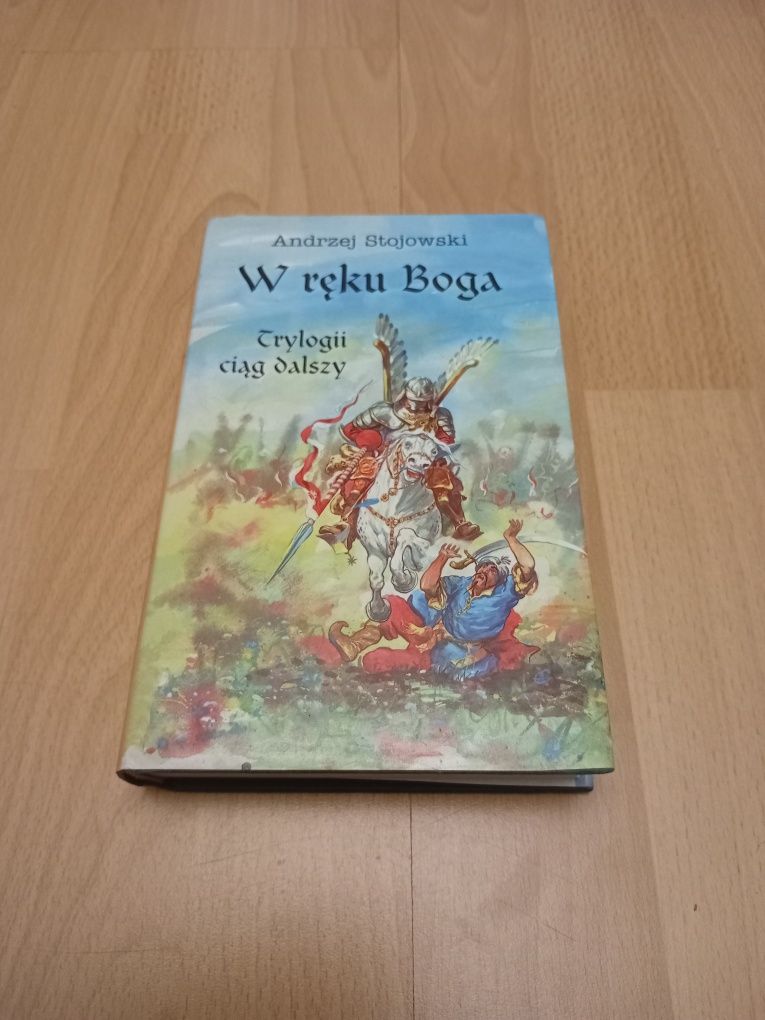 Książka w ręku Boga stojowski