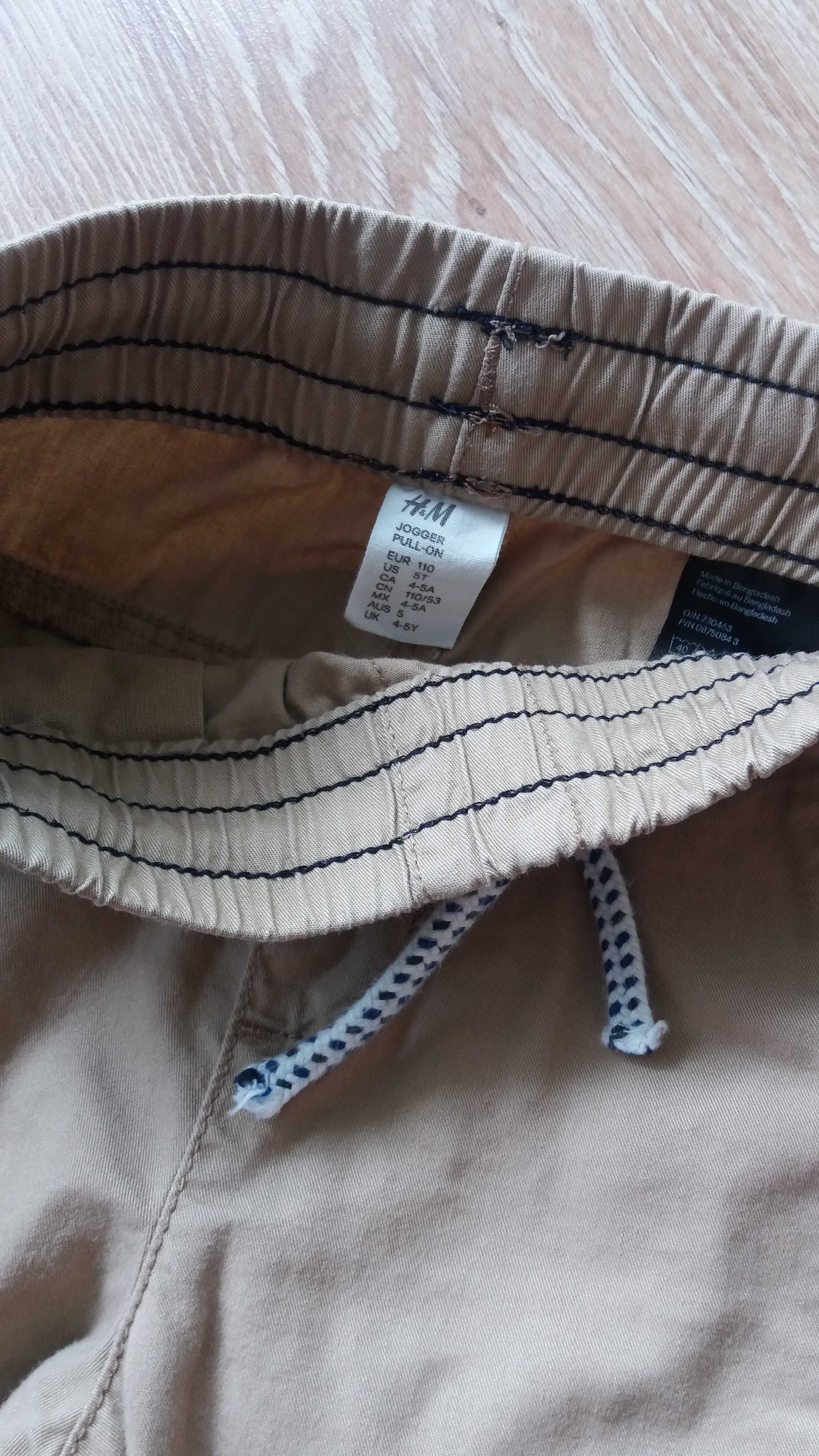 Spodnie H&M dla chłopca z cienkiego materiału rozm 110