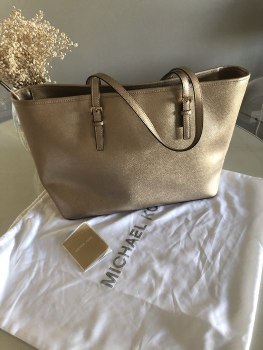 Mala michael kors dourada