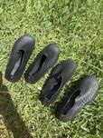 Sapatos de água pretos como novos