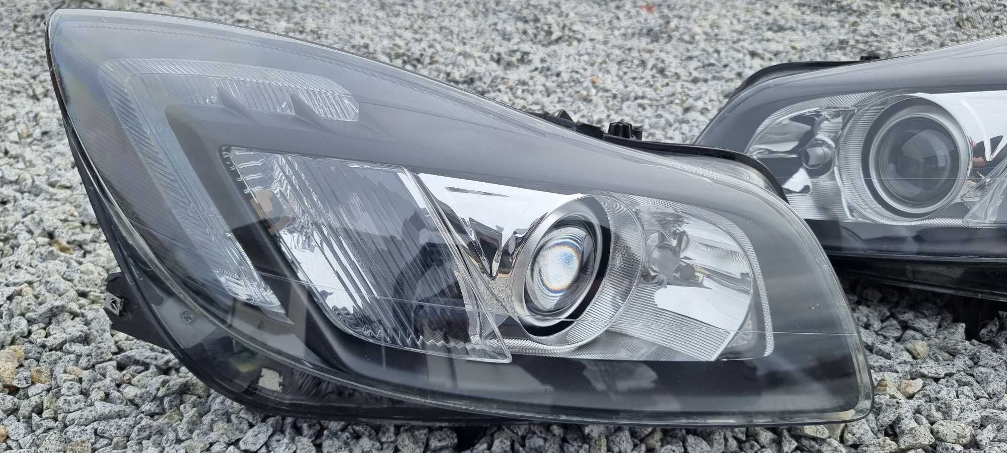 Lampy bi xenon Opel Insignia A skrętne regenerowane reflektory HELLA