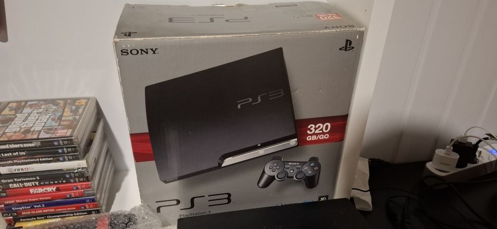 PS3 Slim 320 GB + 2 comandos + 2 microfones + 12 jogos + caixa e manua