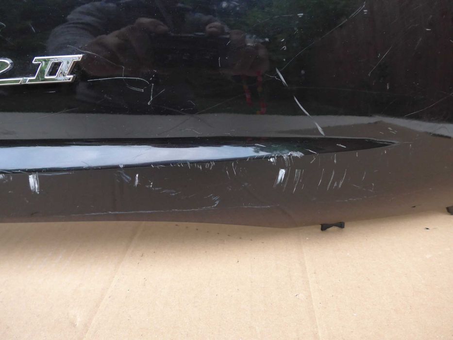 Sym Fiddle II '08-14r OWIEWKA prawy tył emblemat