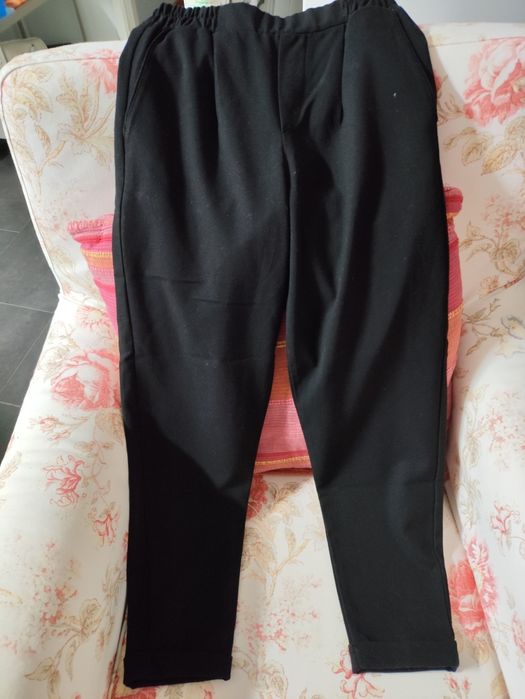 Calças de modelo largo menina