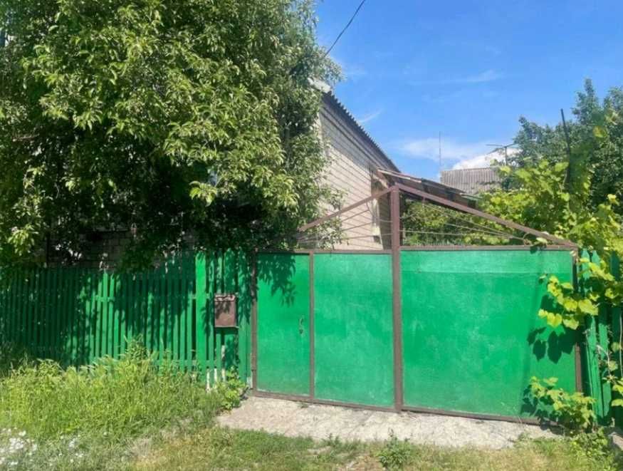 Продам кирпичный Дом на поселке  Строителей в городе Каменское.