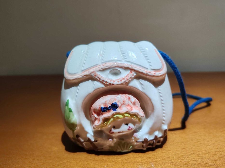 Conjunto de mealheiro e porta retratos em louça. Novo