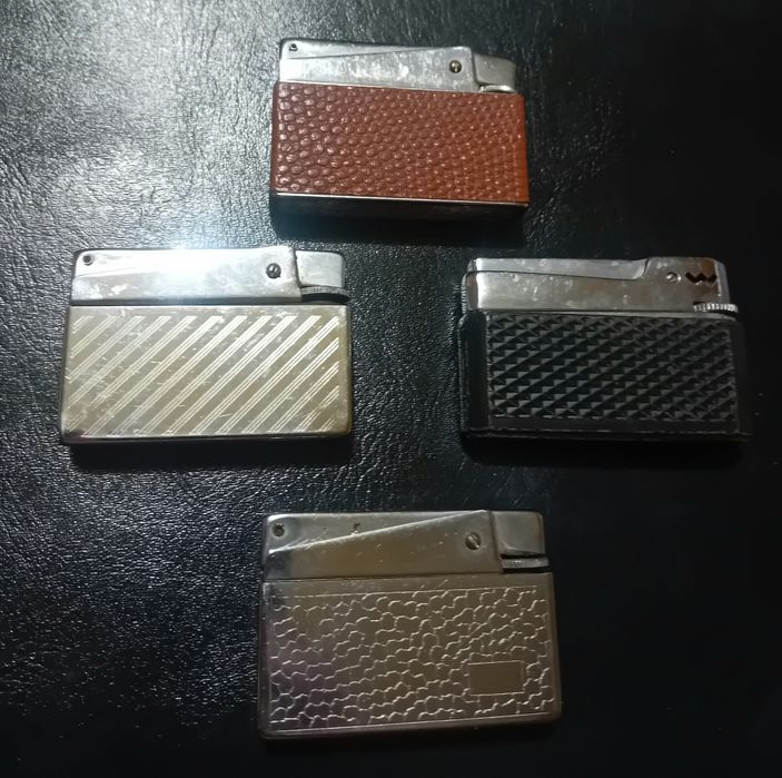 Cztery wiekowe kolekcjonerskie zapalniczki