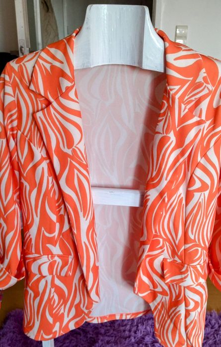 Blazer da pérola com meia manga.