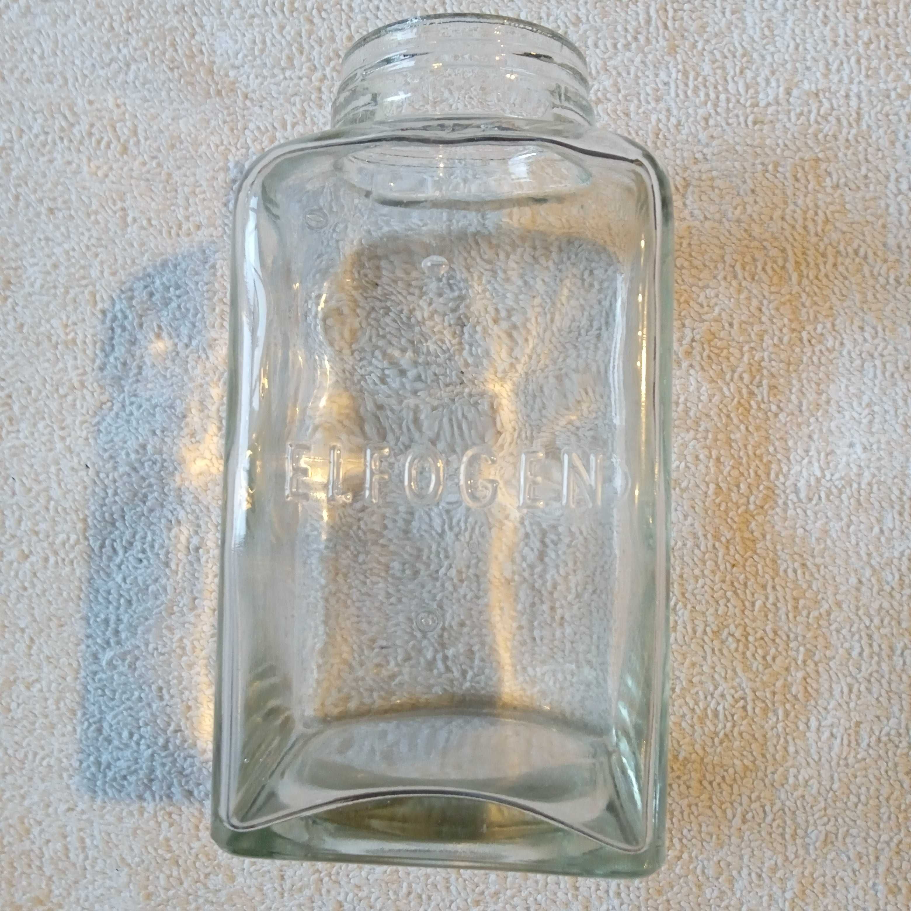 Zabytkowa butelka apteczna z tłoczonym napisem Elfogen.