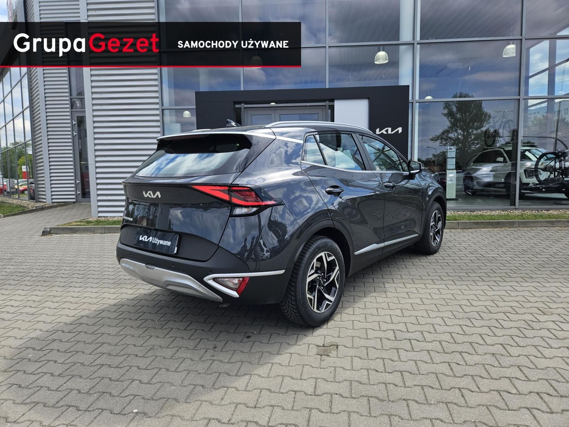 Kia Sportage 1.6 T-GDI 150KM MHEV, M + Smart, automat, kamera, drugie opony, FV23%