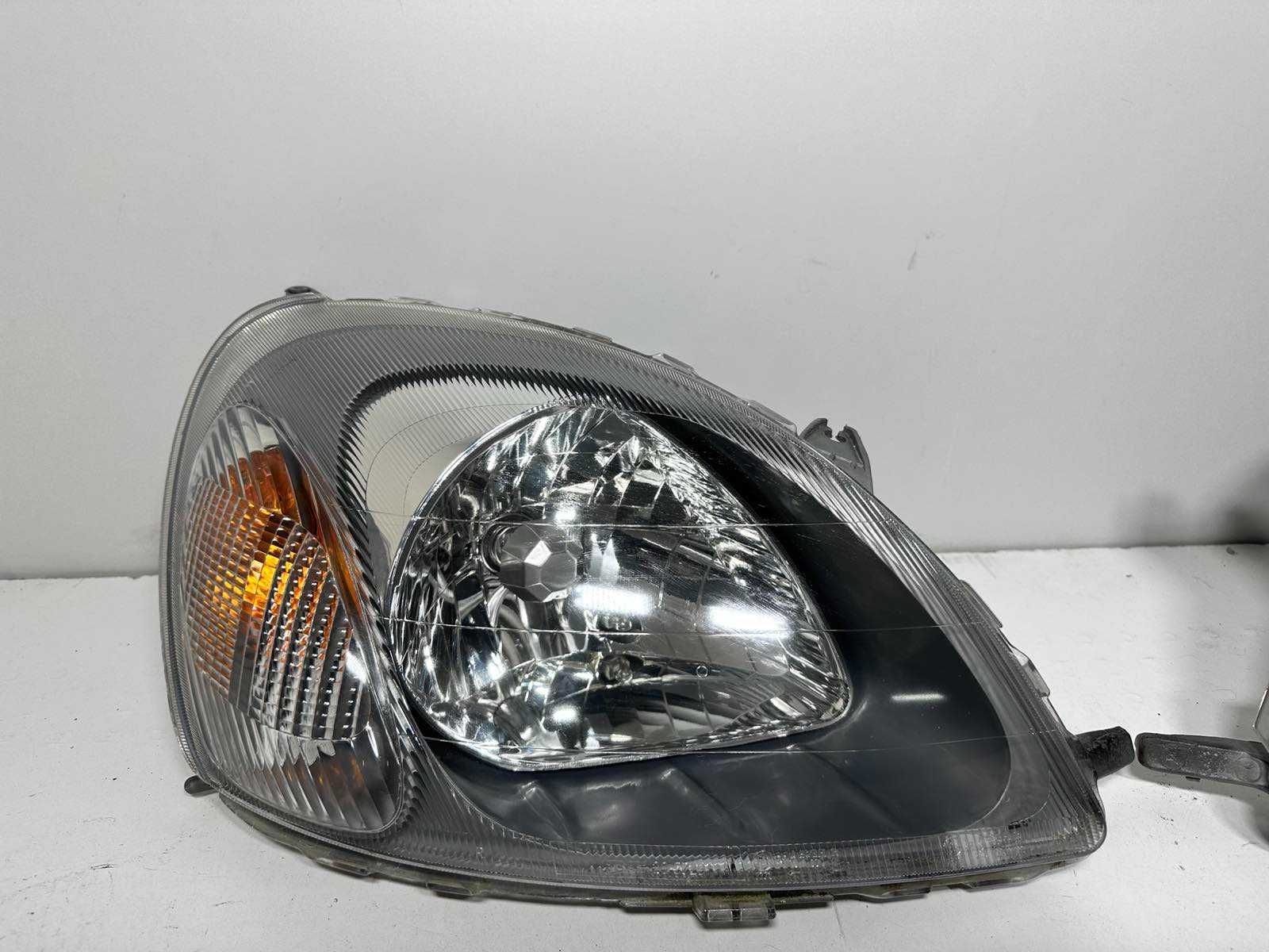 Toyota Yaris I Prawy Lewy reflektor lampa zwykła EUROPA cana za 1 st