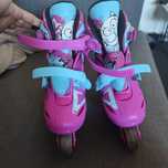 Patins em linha rosa