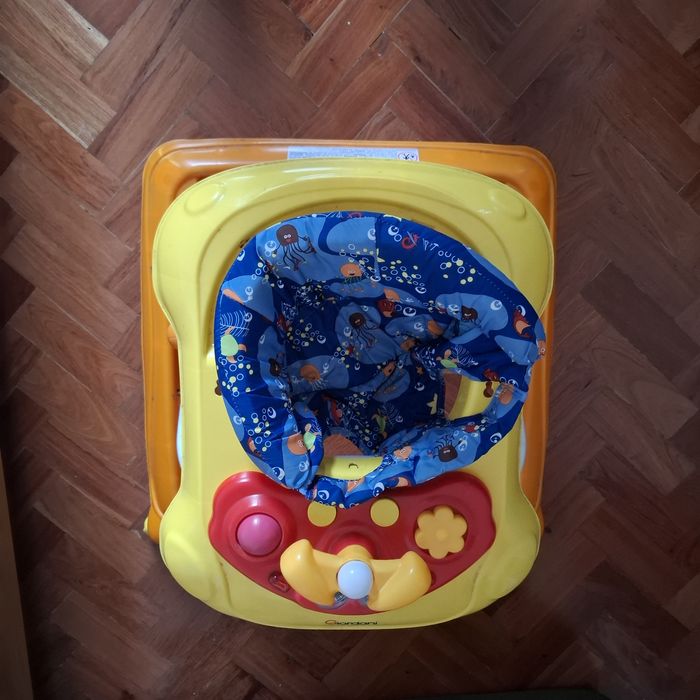 Baby walker with play station