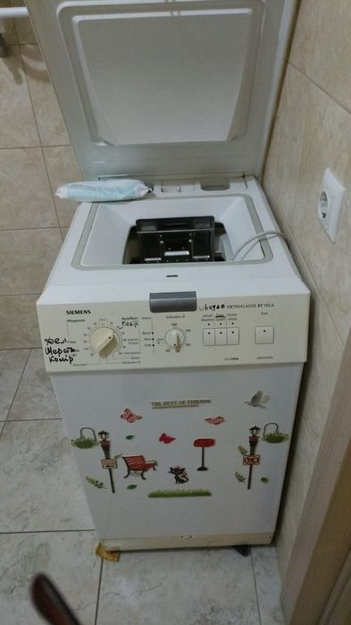 Пральна машина Siemens (вертикальна загрузка)