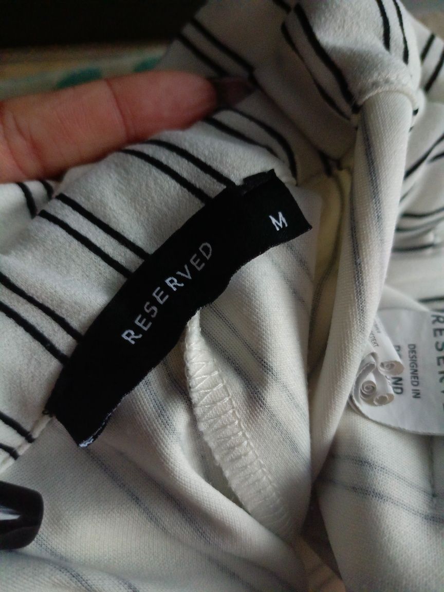 Białe spodnie Reserved M