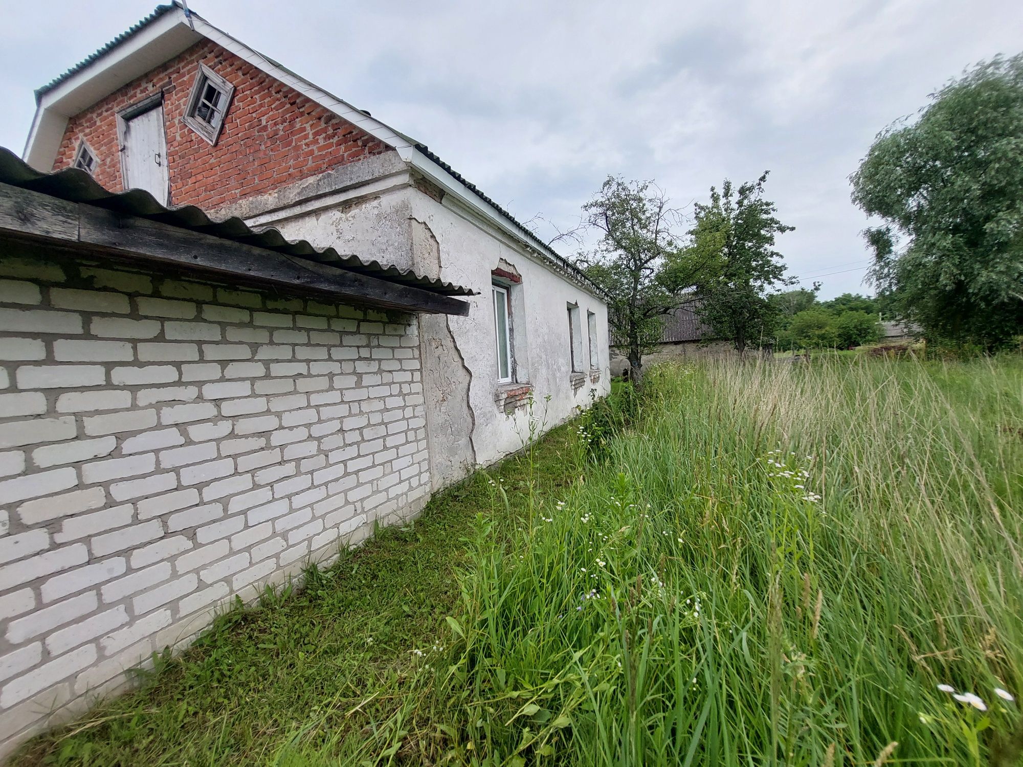 Будинок із земельною ділягкою під сільське господарство 0.1500 га