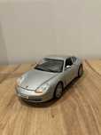 Samochod porsche carrera 911 1:18 welly