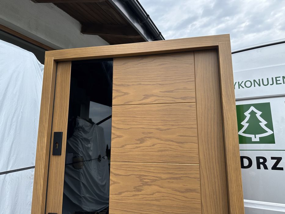 Drzwi zewnetrzne drewniane Montaż Cała Polska dębowe czarna szyba