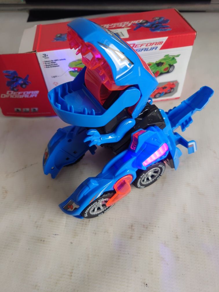 Samochód Dinozaur autko świecące na baterie Transformer wiek 3+