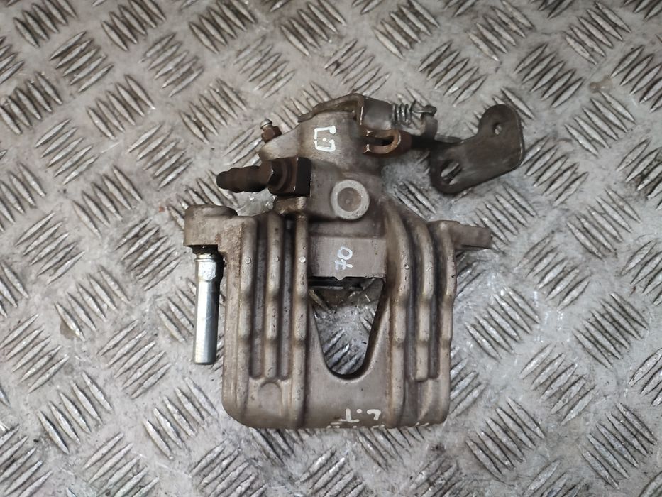 Opel Astra III H zacisk hamulcowy lewy tył tylny