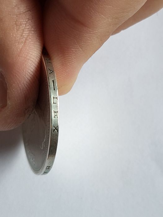 Srebrna moneta Nike 1928 TYP A ze znakiem mennicy.