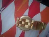 Relógio swatch dourado