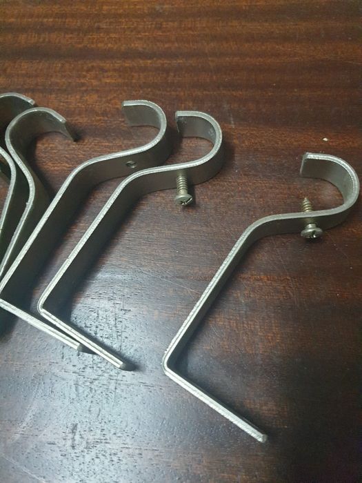 Suportes para varões de cortinados
