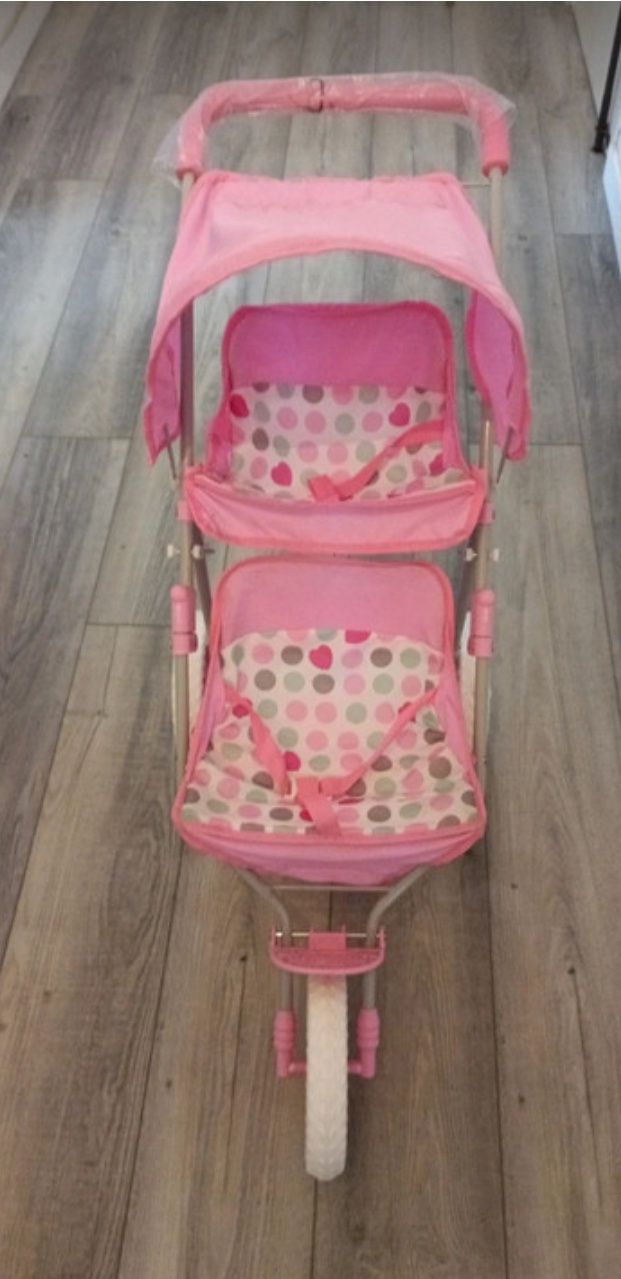 Carrinho de bebê de brincar com 2 lugares. Como novo.