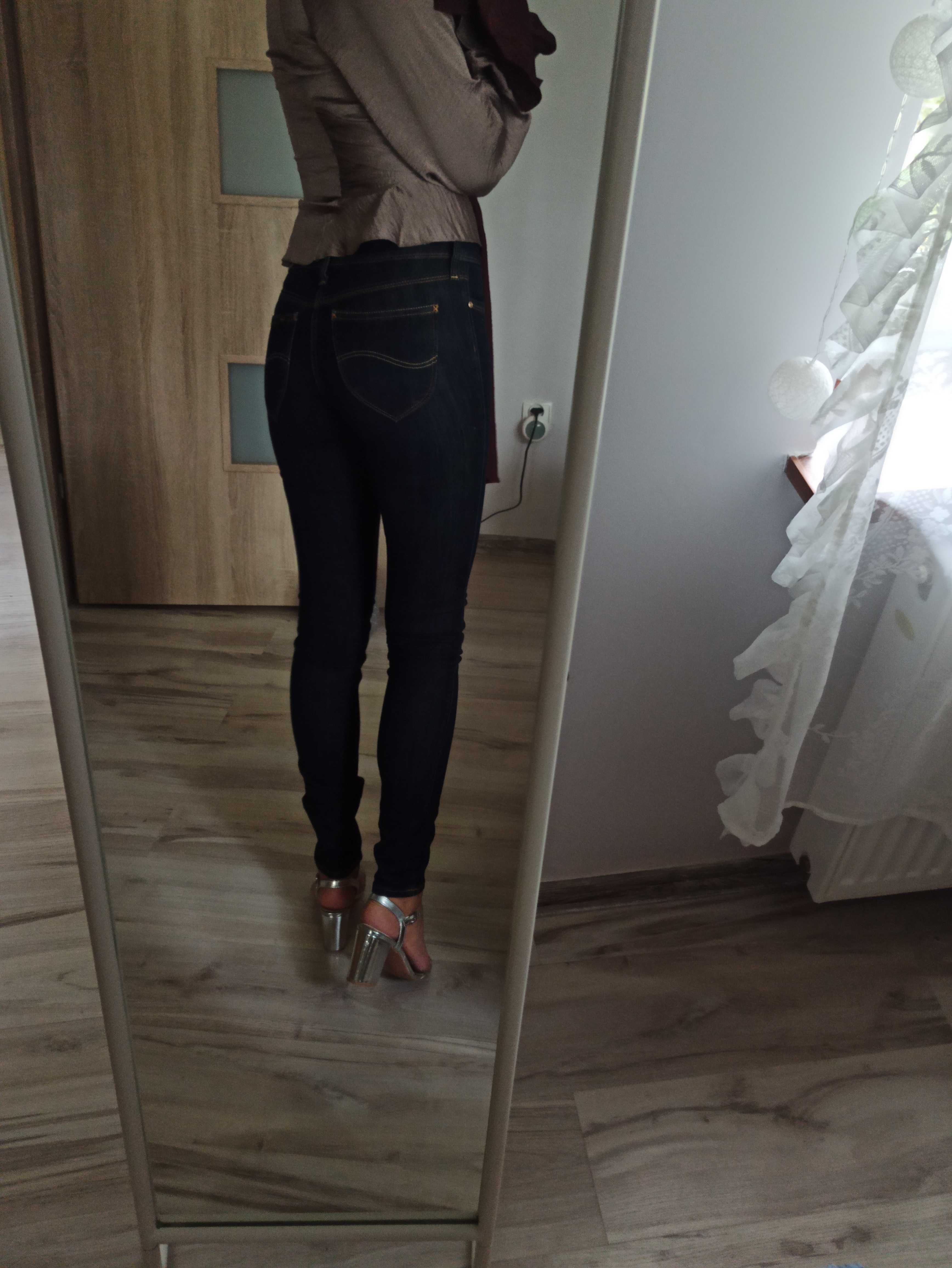 Spodnie Lee oryginalne jeansy dżinsy damskie biodrówki ciemne