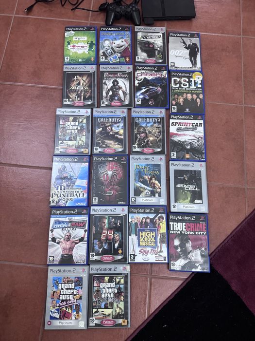 Playstation 2 + singstar + volante + jogos