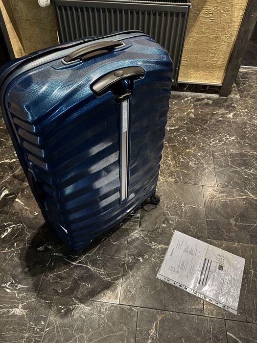 Walizka Samsonite Lite-Shock (American Tourister, Delsey)