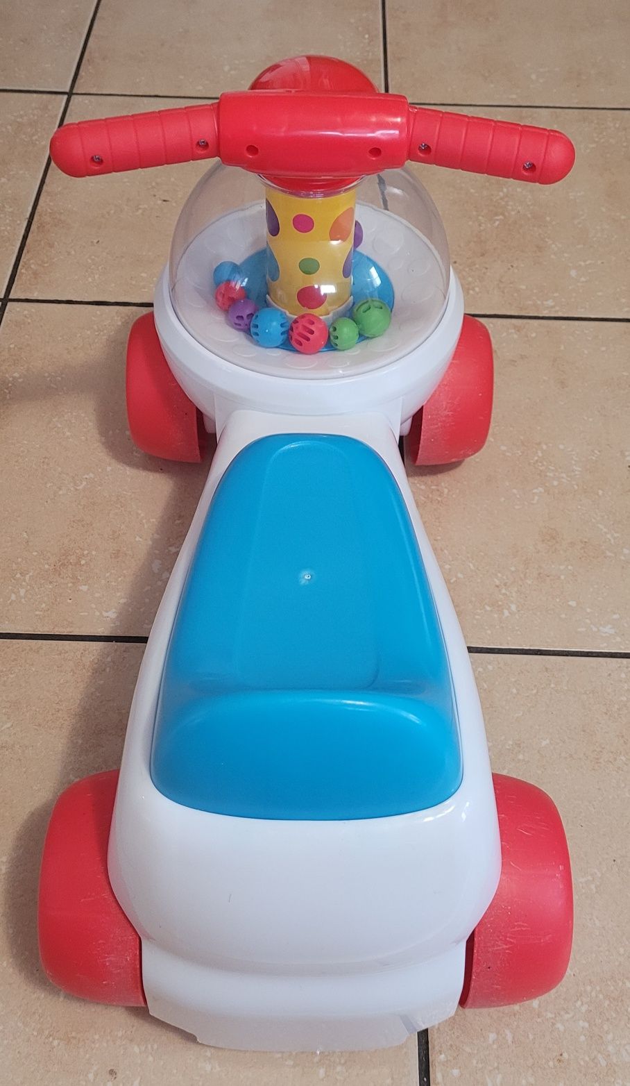 Fisher Price Jeździk z wirującymi piłkami