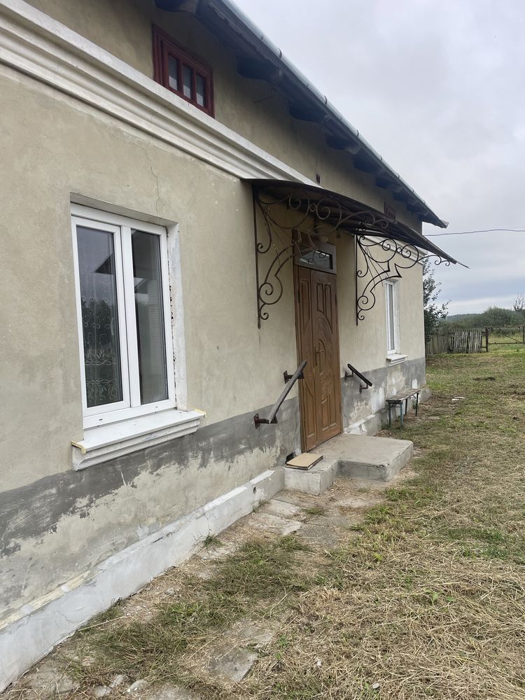 Будинок ,земельна ділянка під забудову