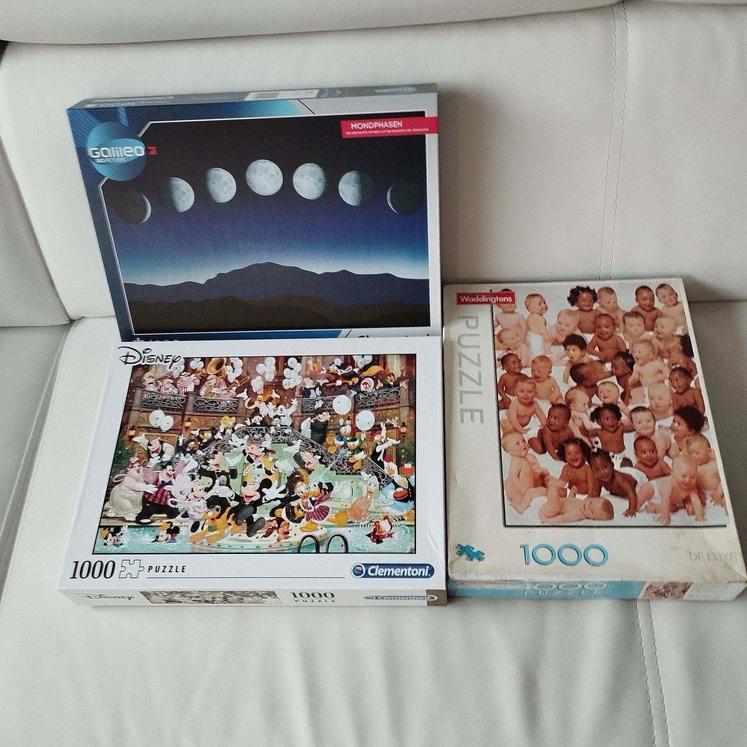 3 pudełka puzzle 1000 dzieci Galileo księżyc i Disney karnawał