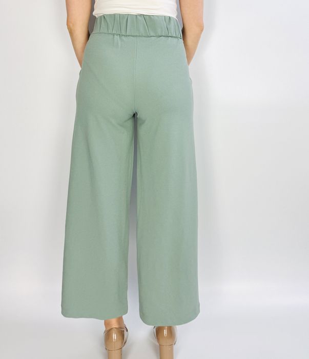 Miętowe spodnie z szeroką nogawką XS 34
