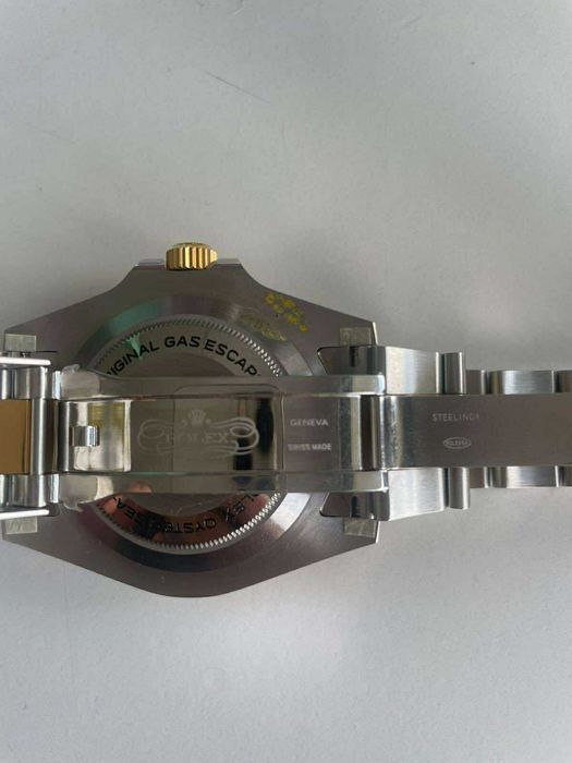 Zegarek Rolex czarno-złoty, stan doskonały