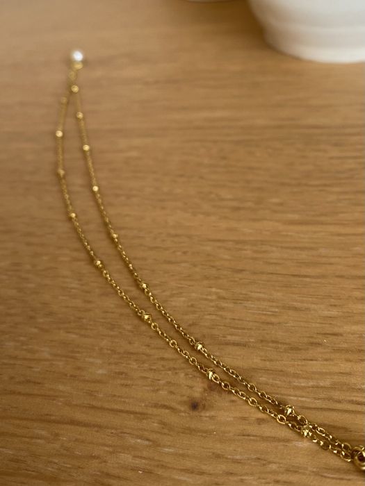 Pulseira dupla dourada