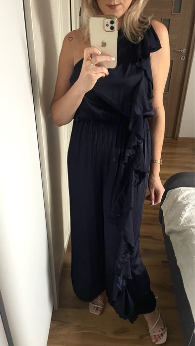 Elegancki kombinezon szerokie nogawki na jedno ramie z falbaną S 36