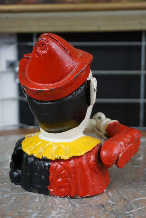 Stara ruchoma skarbonka żeliwna klaun