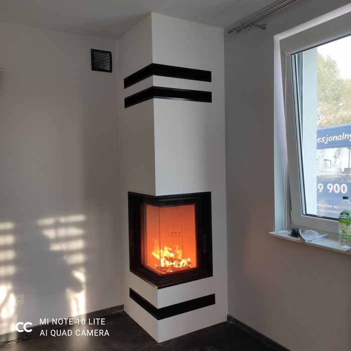 Kominek z szybą boczną narożny kominki