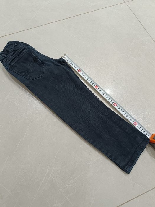 Czarne spodnie jeansowe chłopięce r.116