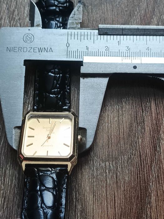 Sprzedam złocony męski zegarek garniturowy Deloitte & Touche