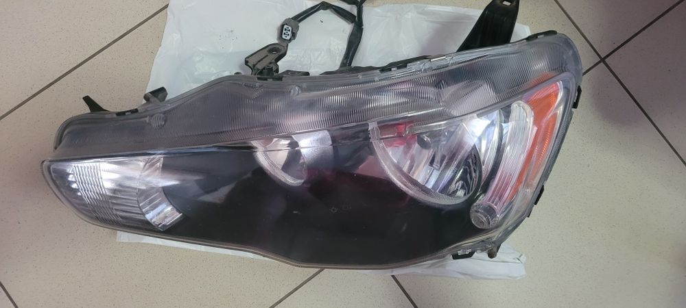Фара передня ліва оригінал Lancer 2008 8301B259